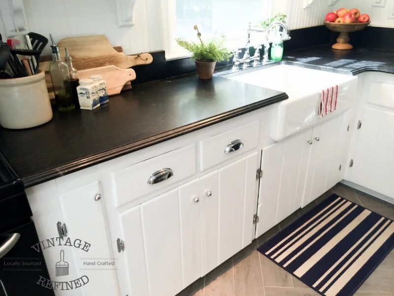 Dark granite countertops in white kitchen makeover, by Vintage Refined featured on @Bekob