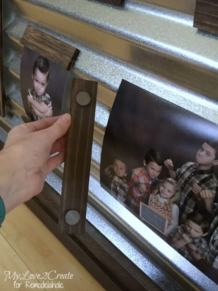 magnetic wood strips on a corrugated metal photo display