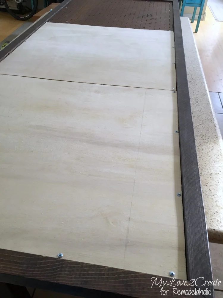 screwing panels into frame