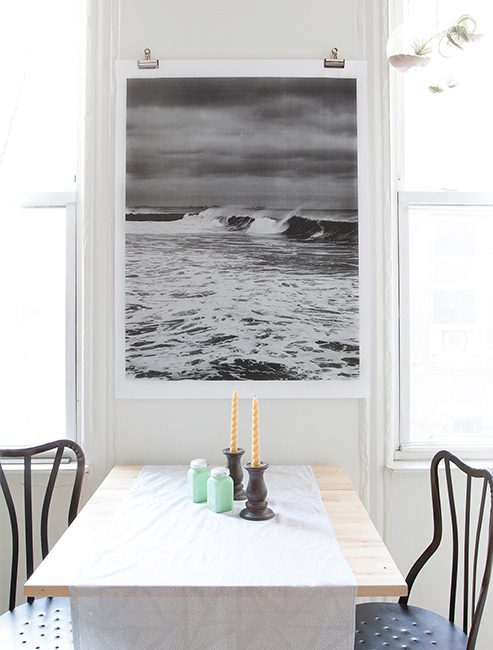 easily hang large wall art, an engineering print with binder clips (via Design Sponge)