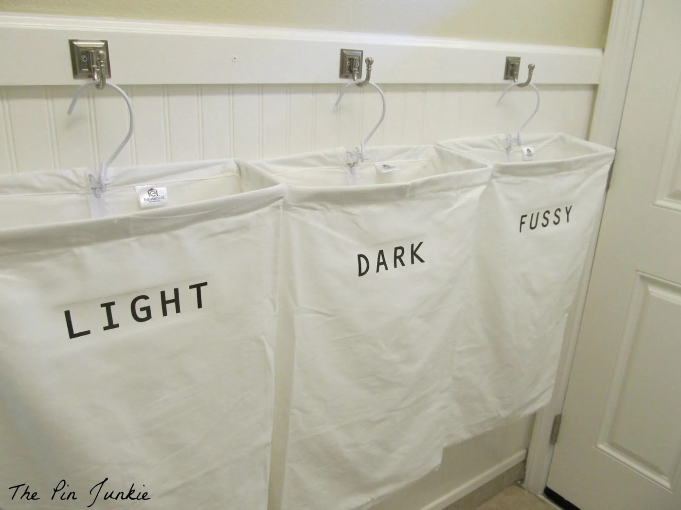 laundry room with personalized hanging laundry bags, The Pin Junkie featured on Bekob.com