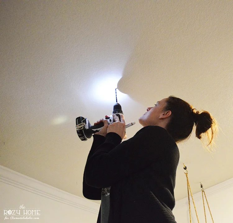 Installing a Handmade swing for kids indoors - dill holes for swing hanging hardware in ceiling