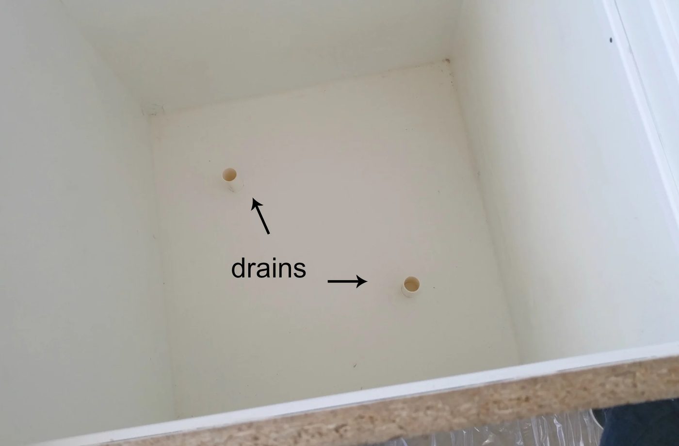 inserting-drains-handmade-tall-concrete-planter