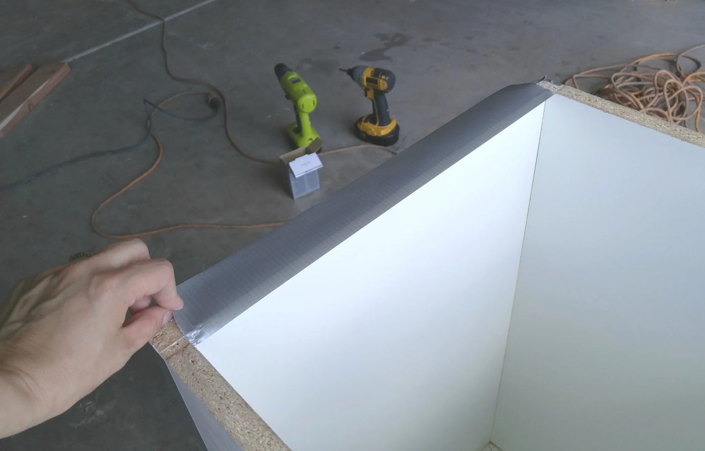 taping-raw-edges-handmade-tall-concrete-planter