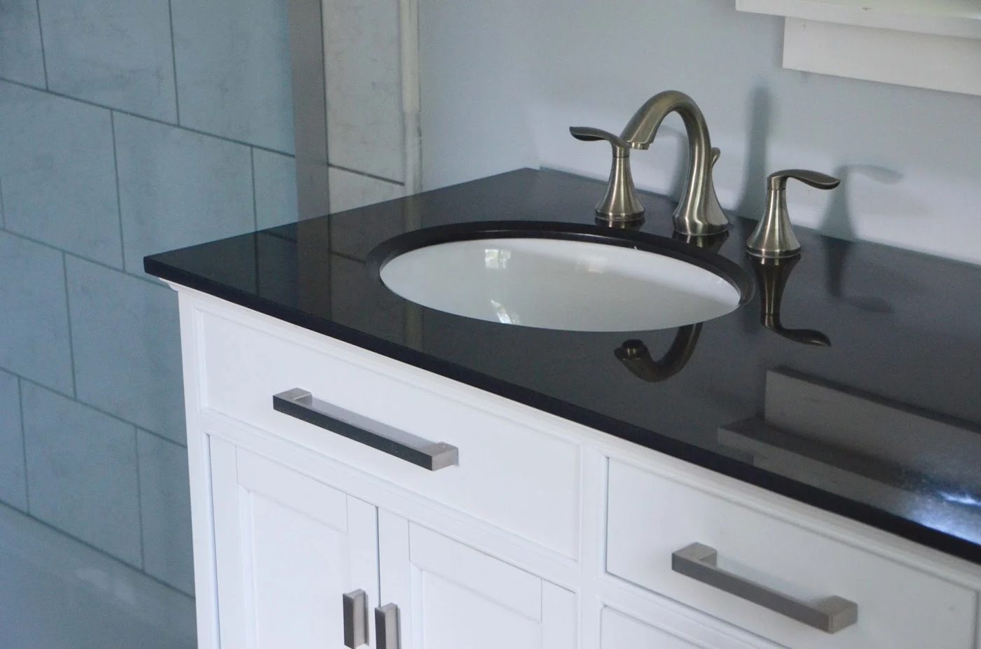 Dark countertop over white vanity, Master Bath Renovation, by Since I Became a Mom featured on @Remodelohic
