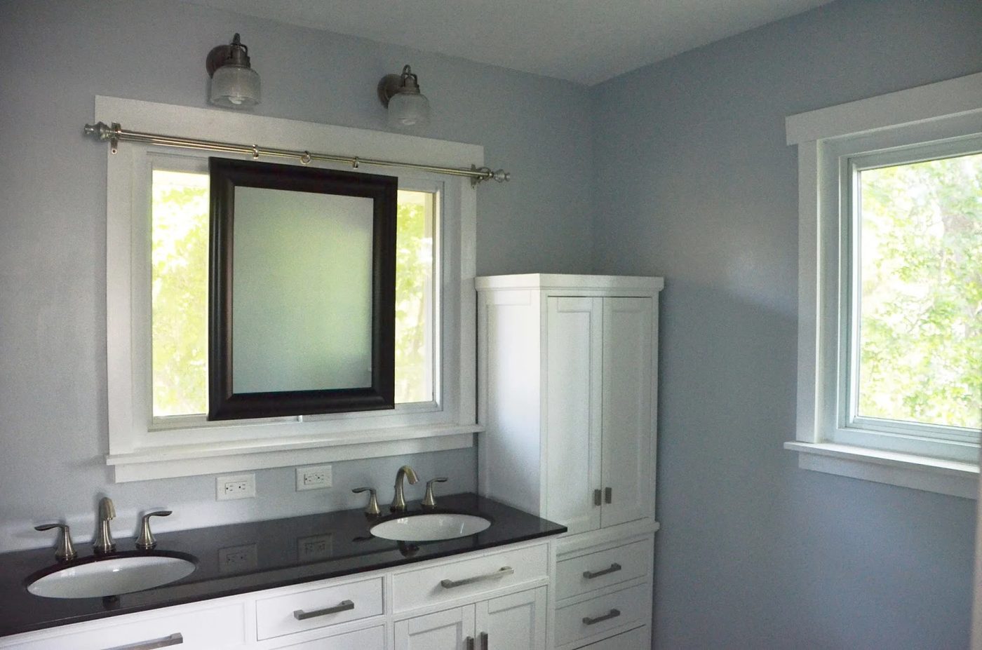 Bathroom Remodel using sliding mirror to preserve natural light