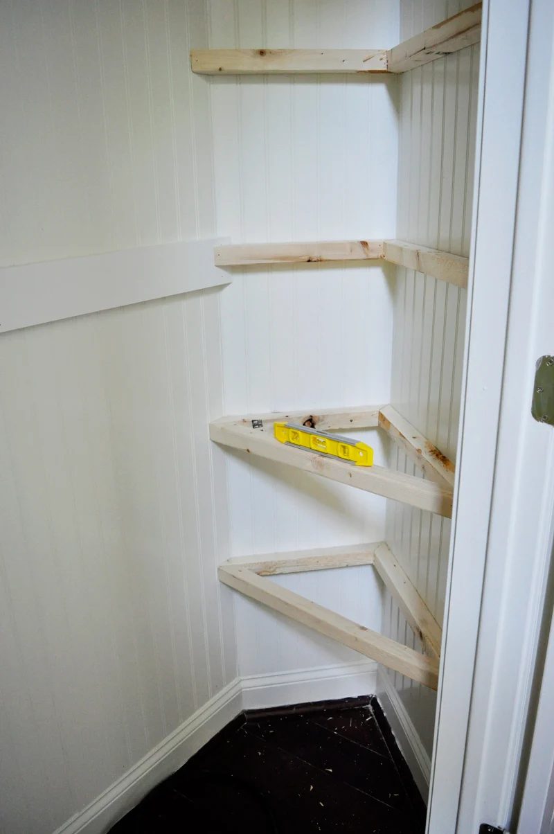 installing floating corner shelves in a hall closet organization options