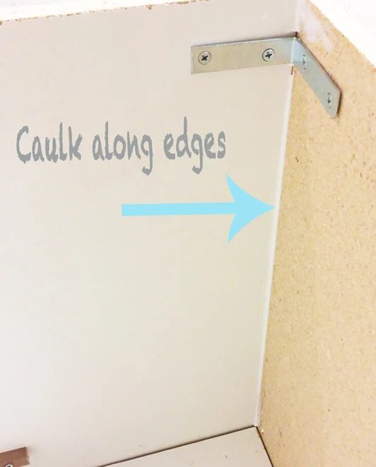 caulking edges on a media wall for a nice clean look at Bekob.com