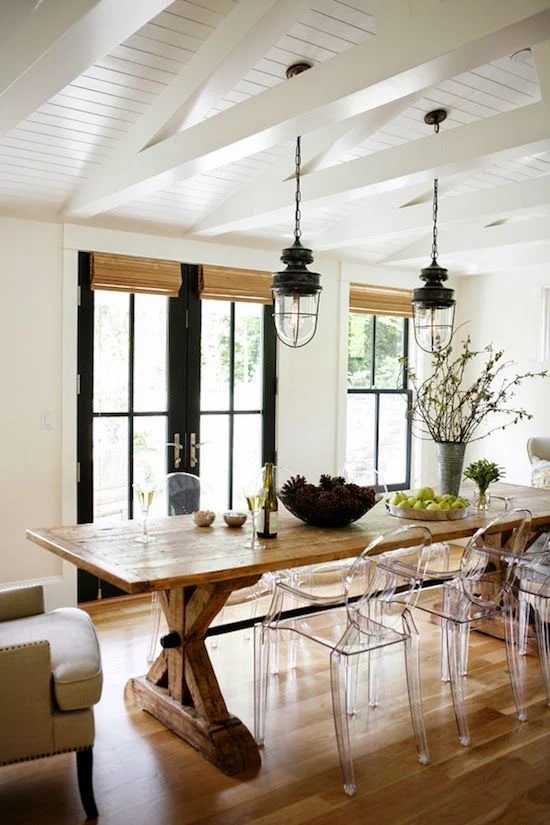 Modern Farmhouse Dining Room -- love the lights and the ghost chairs!
