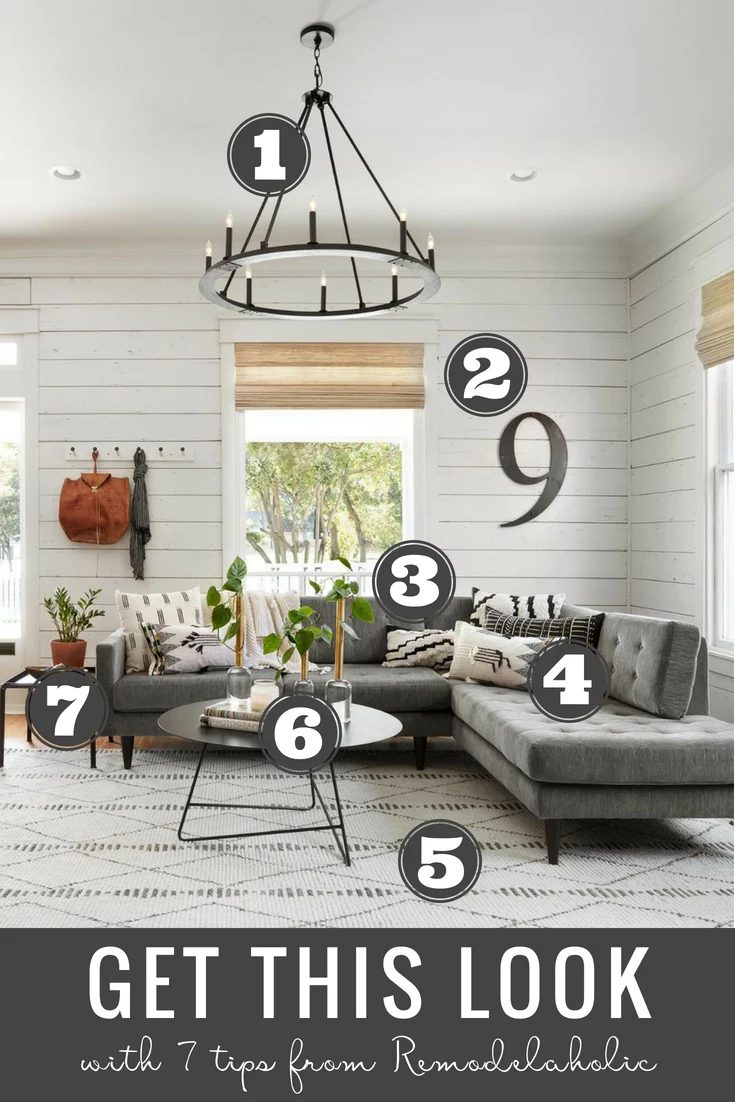 Get This Look: Fixer Upper Living Room from The Americana House | Recreate the iconic Joanna Gaines modern farmhouse chic style from the shiplap and neutral area rug to the chandel