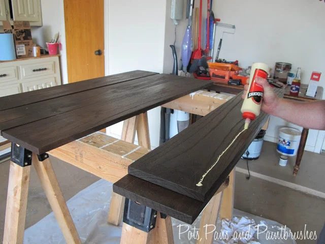 gluing the modern floating mantel shelf