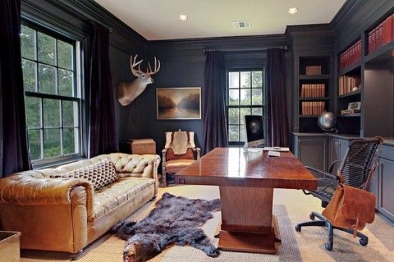 Interesting black office space, love the sofa