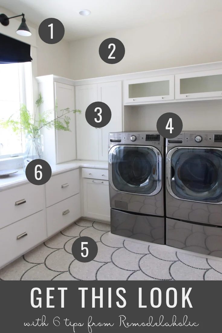 Get This Look: Modern Transitional Style Laundry Room | This large luxurious modern transitional style laundry room features natural light, mosaic tile, white cabinetry and sleek a
