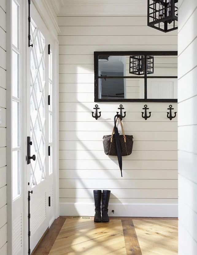 Can I just move in? this mudroom/entry is well fitted. The wood floors, the anchor wall hooks, and that FRONT DOOR!! I want it all.
