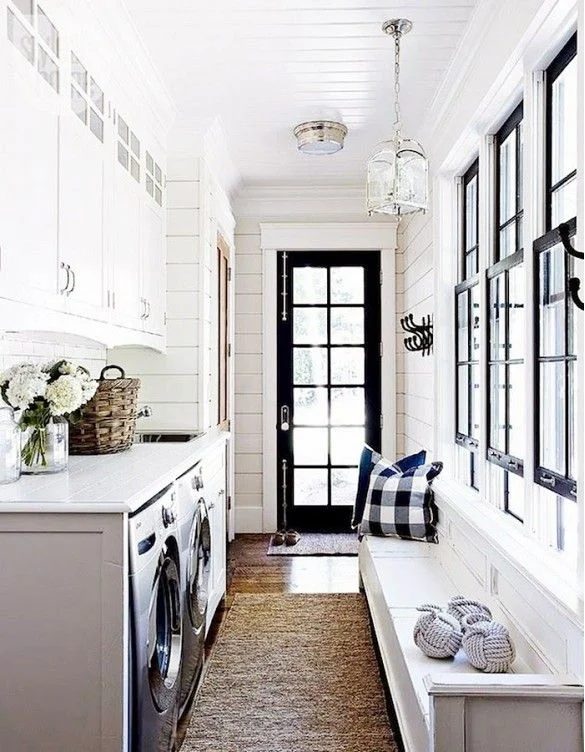 Monochrome Entry Inspiration -- I love the detail added to the cabinets over the washer and dryer.