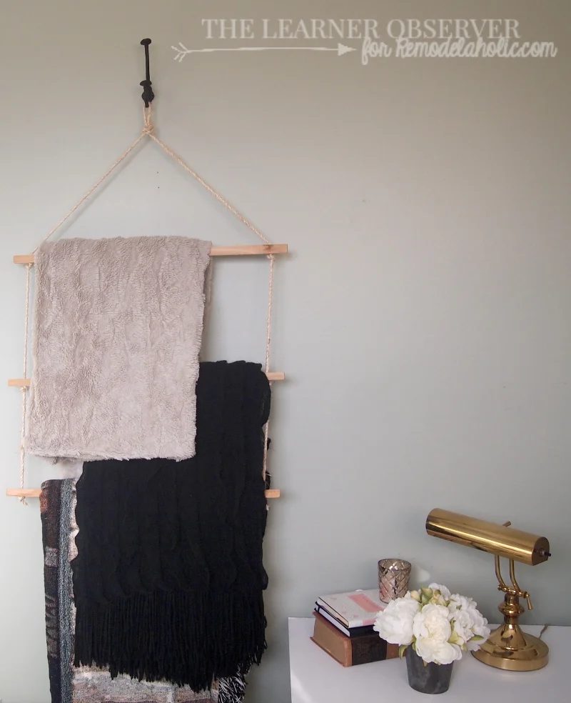 Using just rope and some 1x1 wood you can make a great towel or blanket rack in 15 minutes! Via The Learner Observer for Bekob.com
