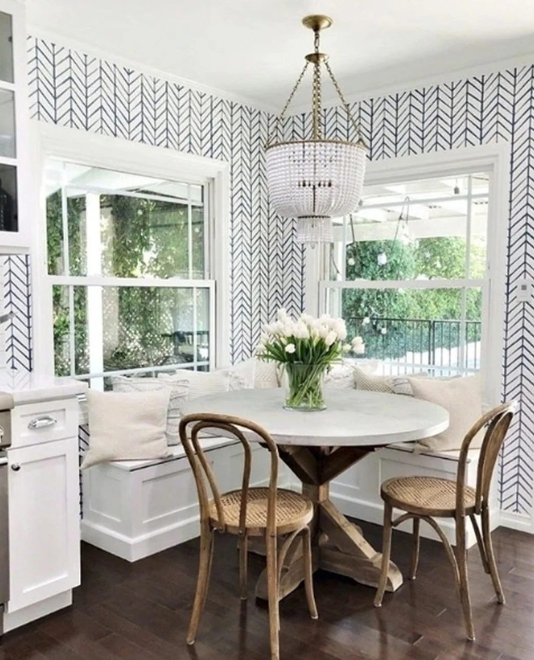 White And Navy Herringbone Wallerpaper With Corner Table And Window To Backyard