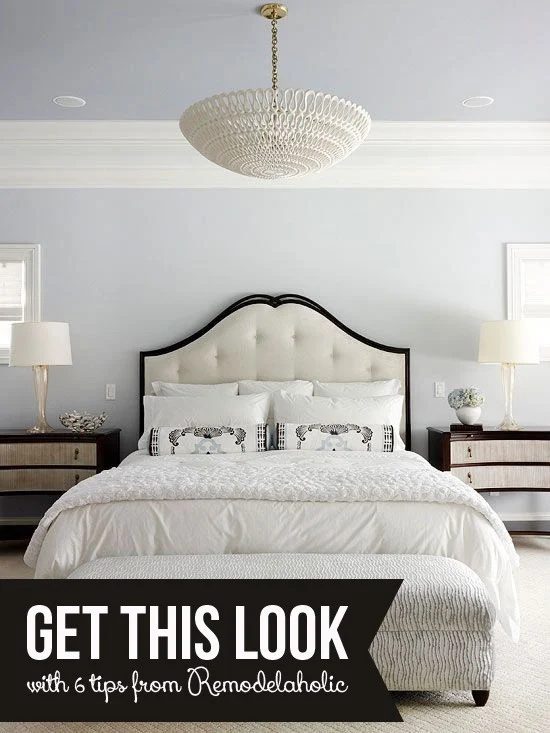 Grey Bedroom With White Trim And White Upholstered Bed With White Bedding