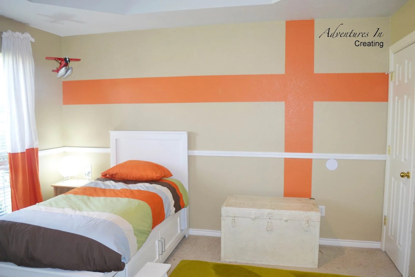 boys room with orange accents