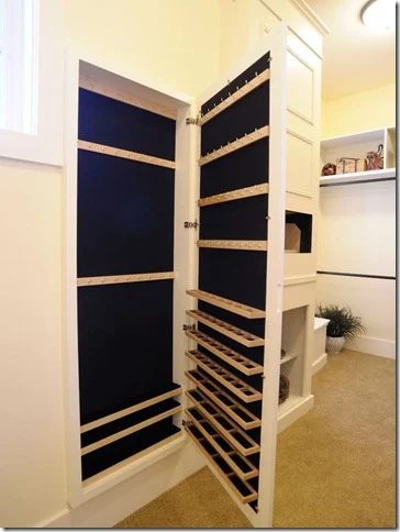 Jewelry storage hidden behind a full length mirror