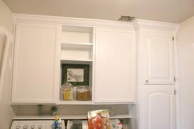 organized laundry room cabinets and shelving