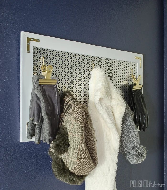 A modern take on pegboard for a hook and clip rack for coats, hats, and scarves Polished Habitat