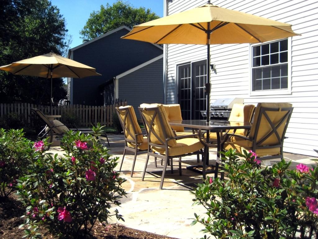 overhaul your backyard with a new landscape, patio, and furniture
