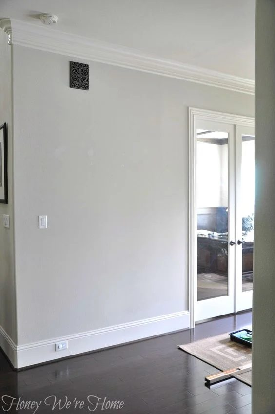 Paint colors for wood floors and trim: Agreeable Gray from Sherwin Williams.