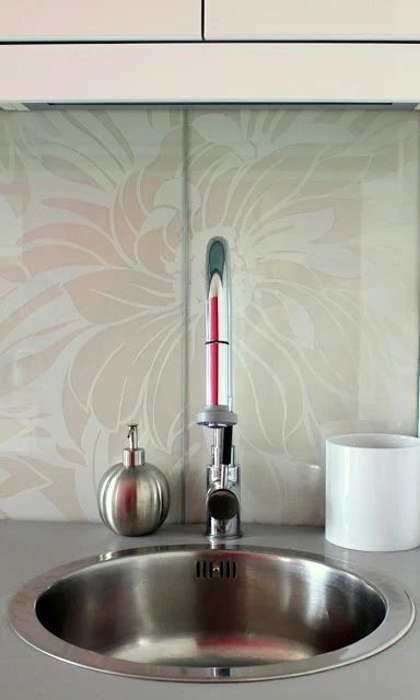 customized glass backsplash using shelving - Preciously Me on Ikea Hackers