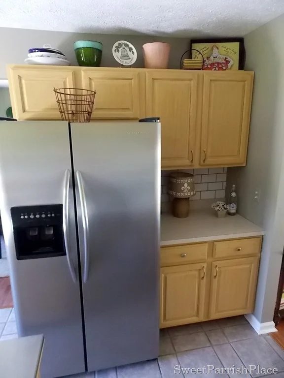 painted subway backsplash by fridge