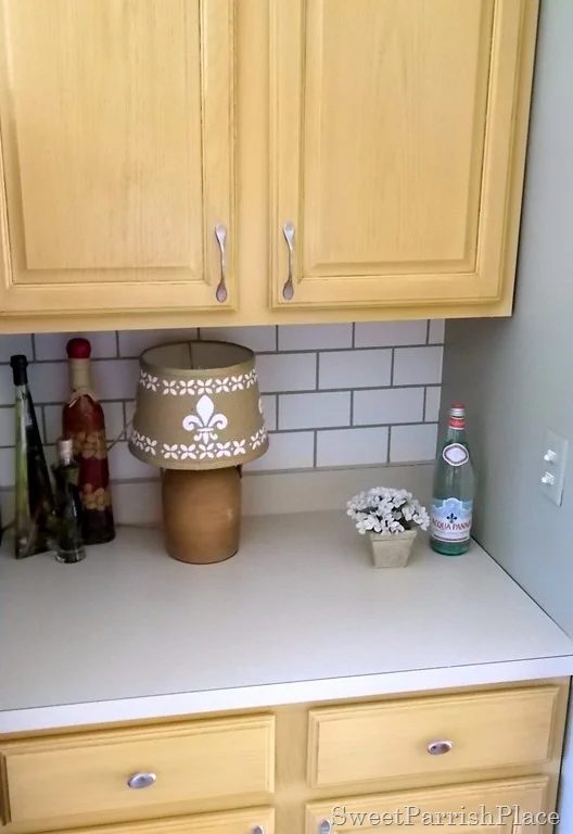 painted subway tile backsplash by fridge