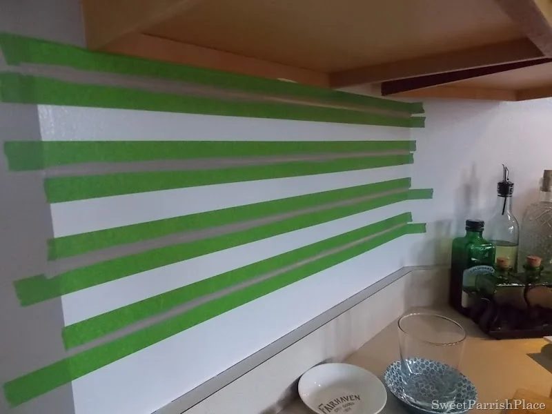 taping painted subway tile backsplash