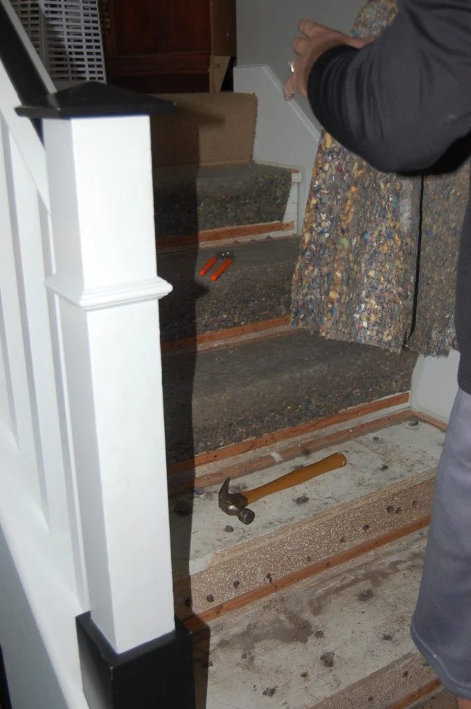 stair remodel, tearing up the carpet