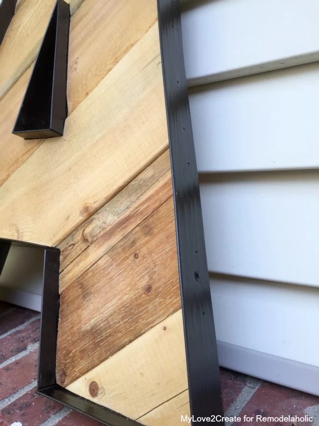 close up of faux metal banded pallet letters -- I can't believe what she used to fake the metal part!