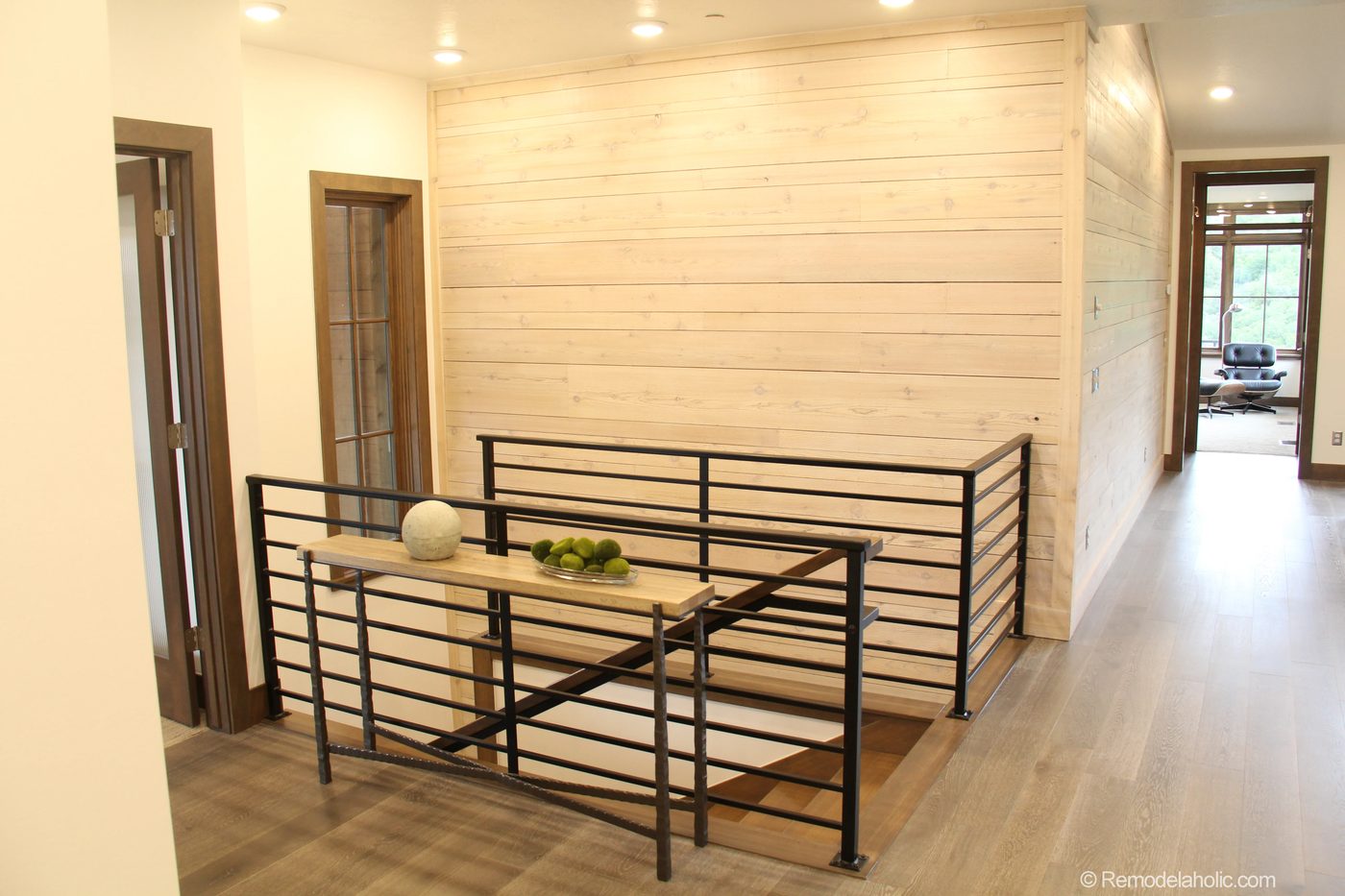 Modern Staircase and white washed wood wall