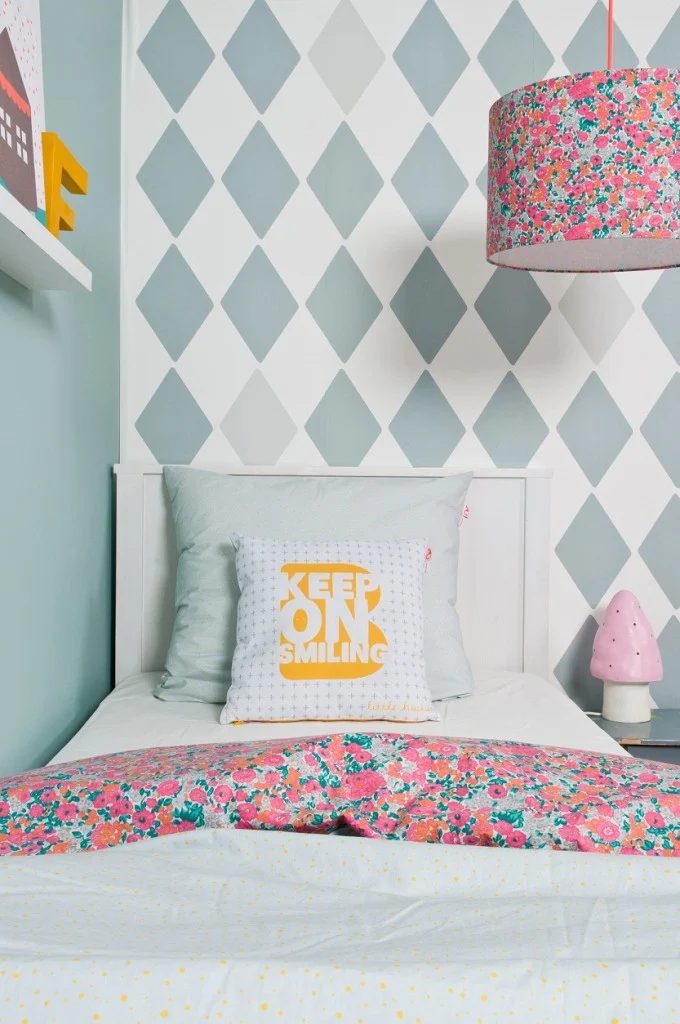pattern mixing girls room with diamond argyle wall