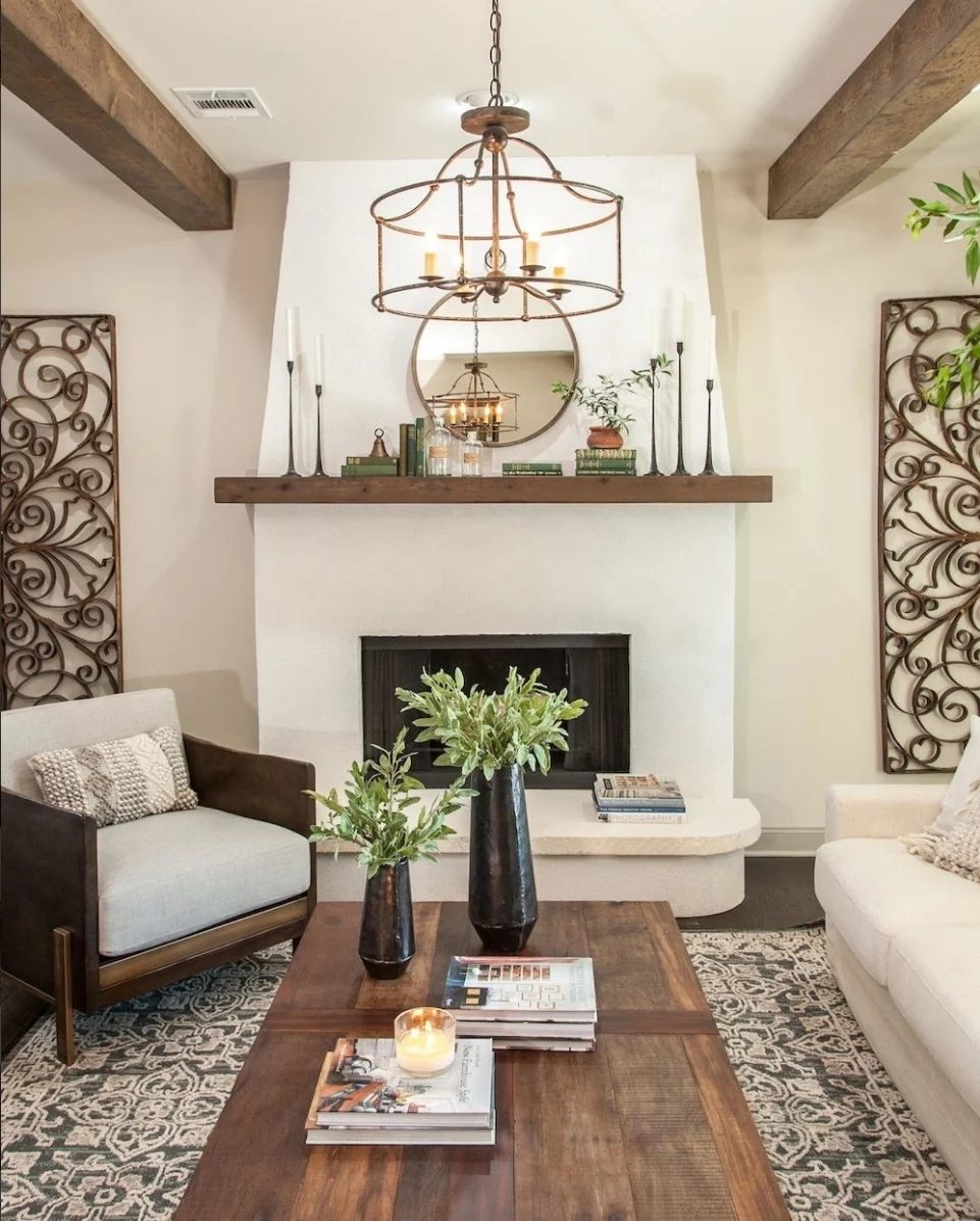 Neutral Living Room With Wooden Beams In The Ceiling And Metal Accents And Wooden Coffee Table