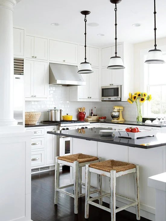 U shaped kitchen layout in white with subway tile via BHG
