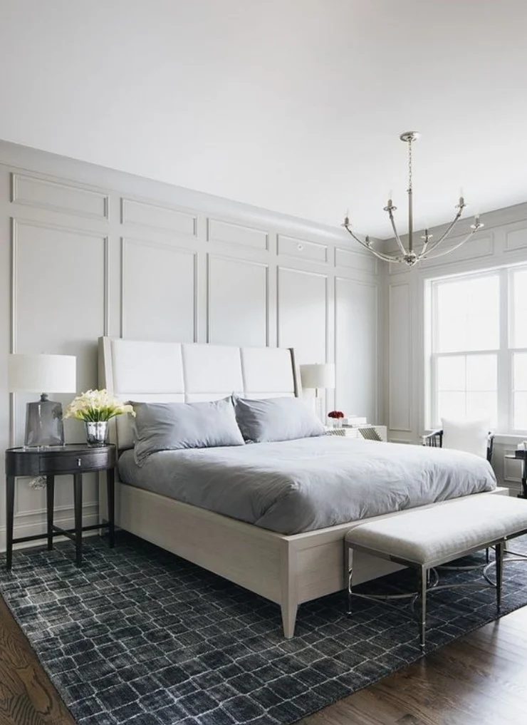 Grey Textured Walls With White Bed, Grey Sheets And Wooden Side Tables
