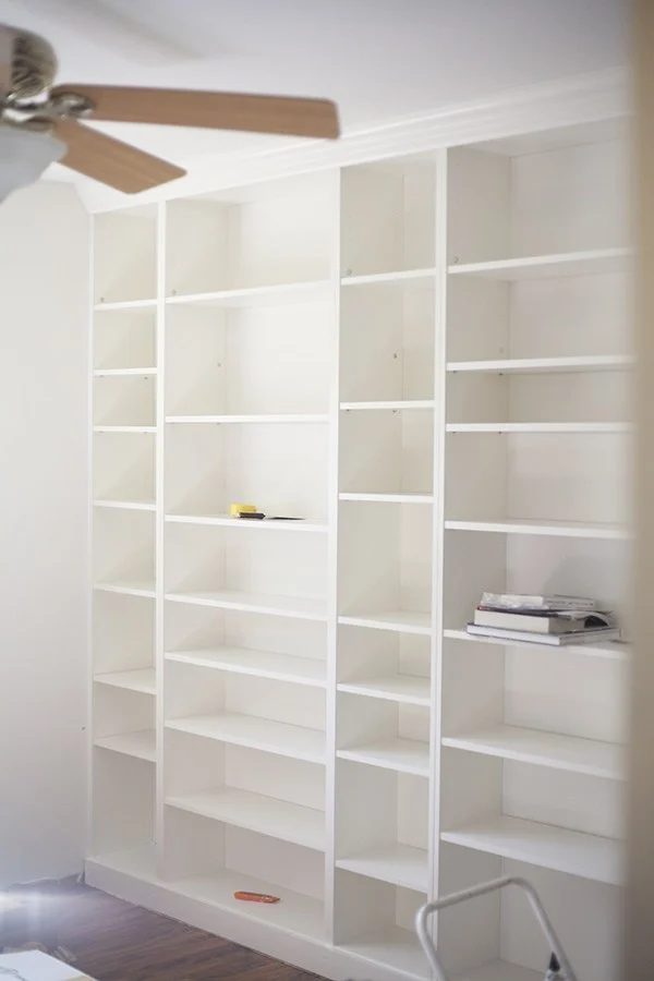 Pure White Built In Shelves Of Every Size, All Empty, Against White Walls