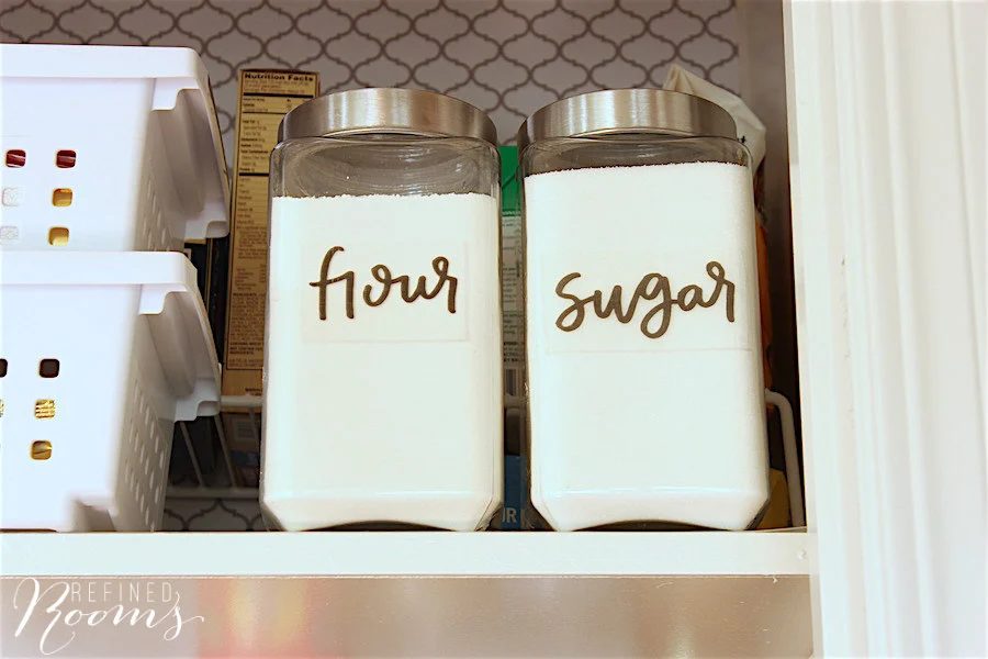 9 Glass Storage Jars With Clear Acrylic Printed Stickers For Use In Pantry Organization, By Refined Rooms Featured On @Bekob