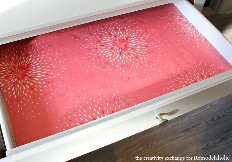 Use clear contact paper over wrapping paper to make drawer liners. Bekob