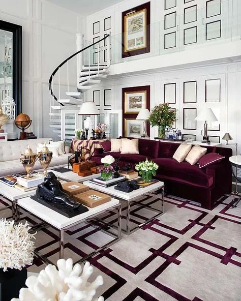 Decorating a neutral living room, with a maroon couch