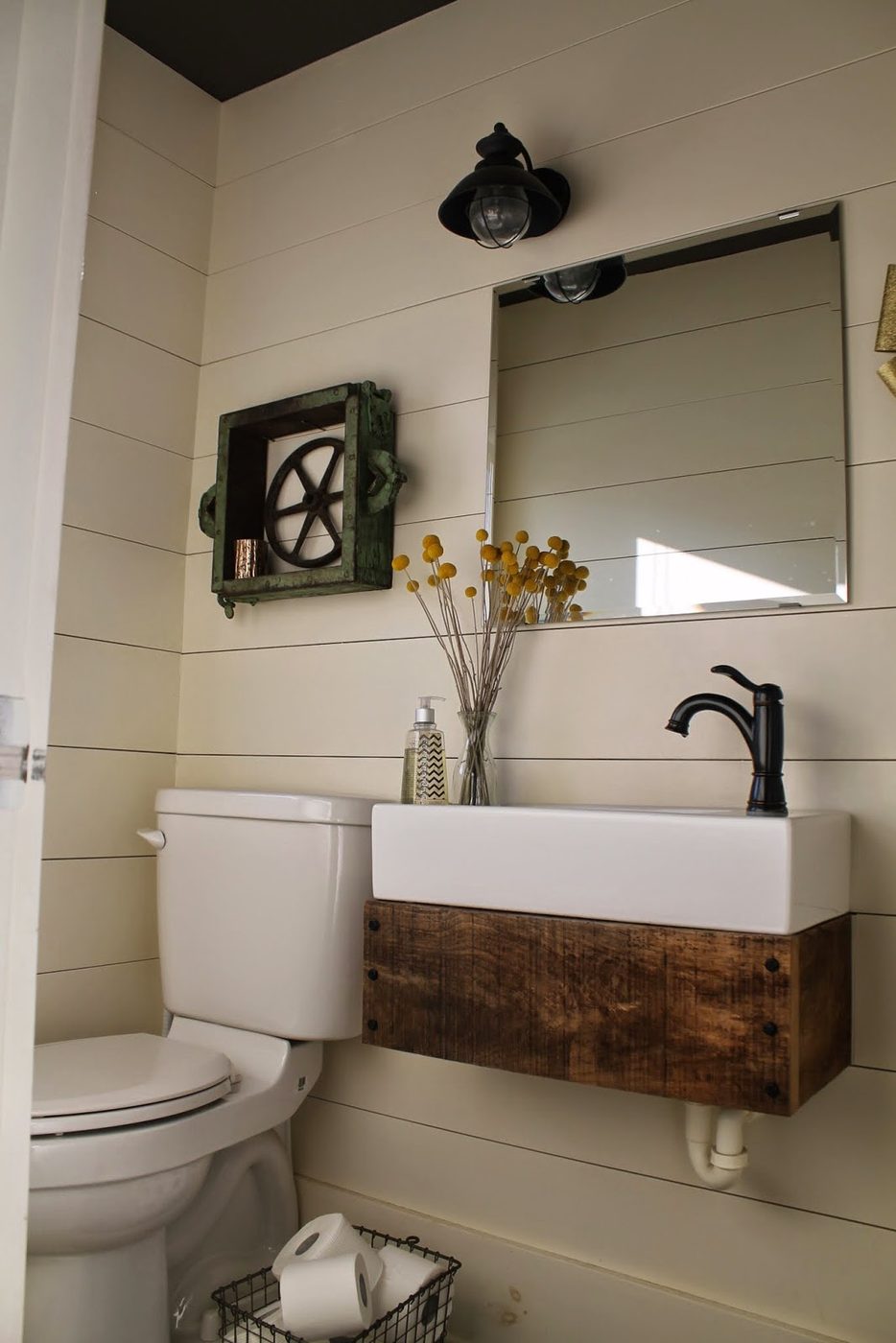 rustic reclaimed wood floating vanity in bathroom with planked walls - Girl Meets Carpenter featured on @Bekob