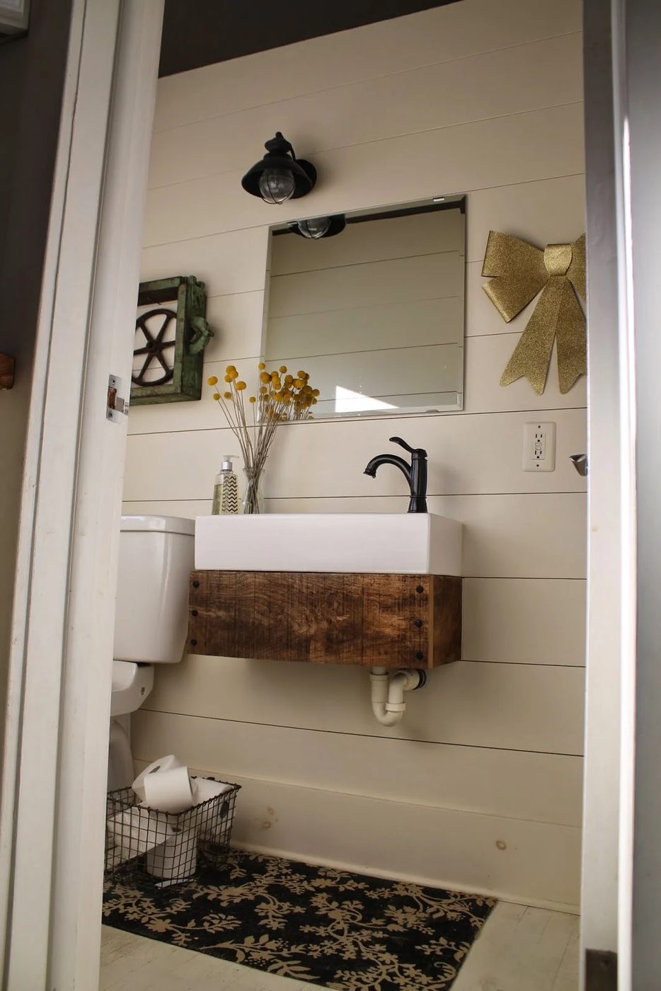 industrial style bathroom with planked walls and Handmade floating reclaimed wood vanity - Girl Meets Carpenter featured on @Bekob