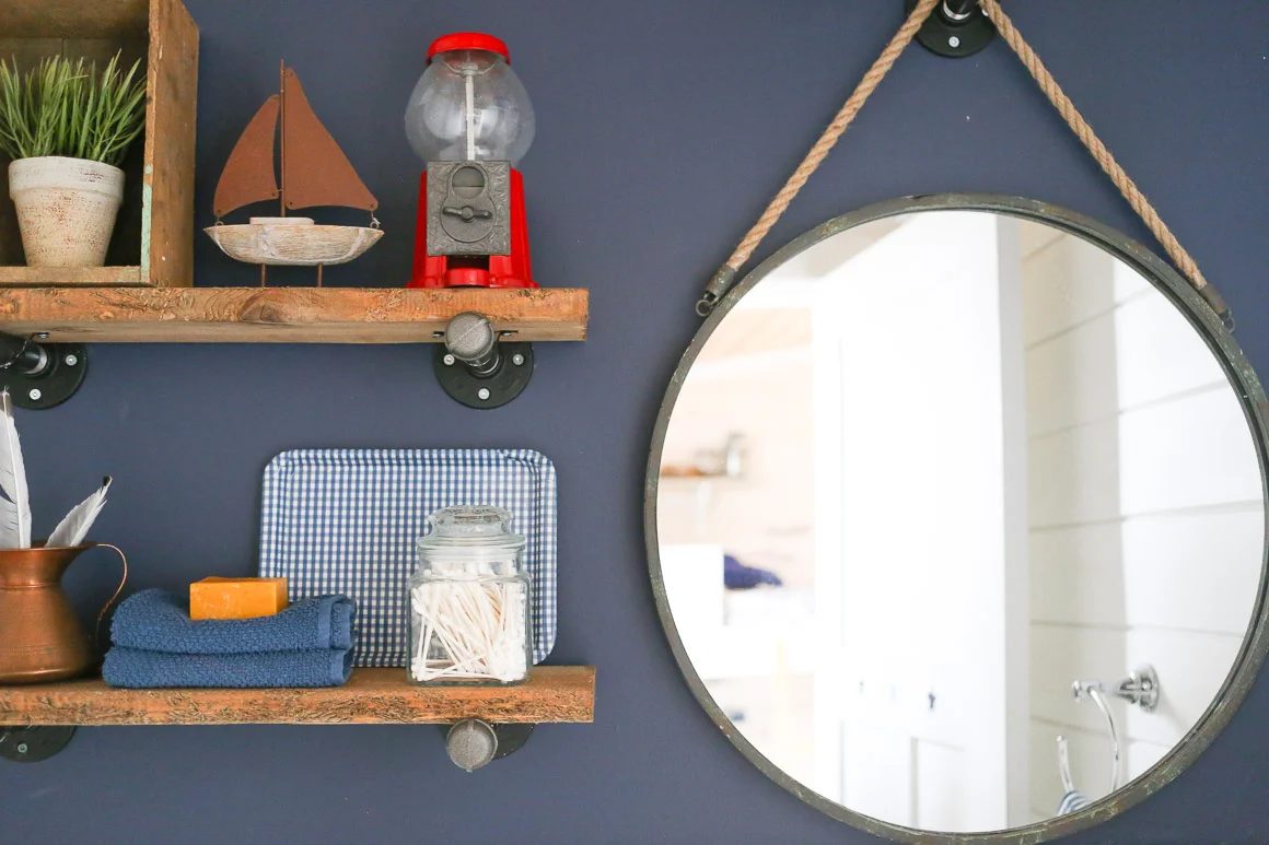 Rustic industrial shelves in a bathroom.