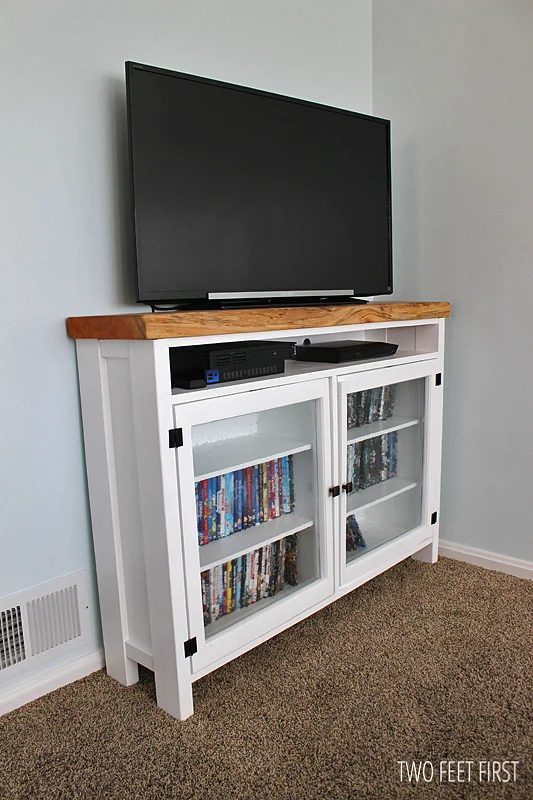 A tv console table made of old windows.