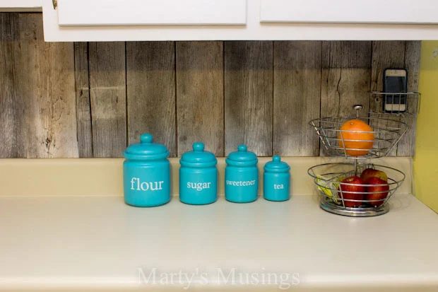 A back splash made of reclaimed wood.