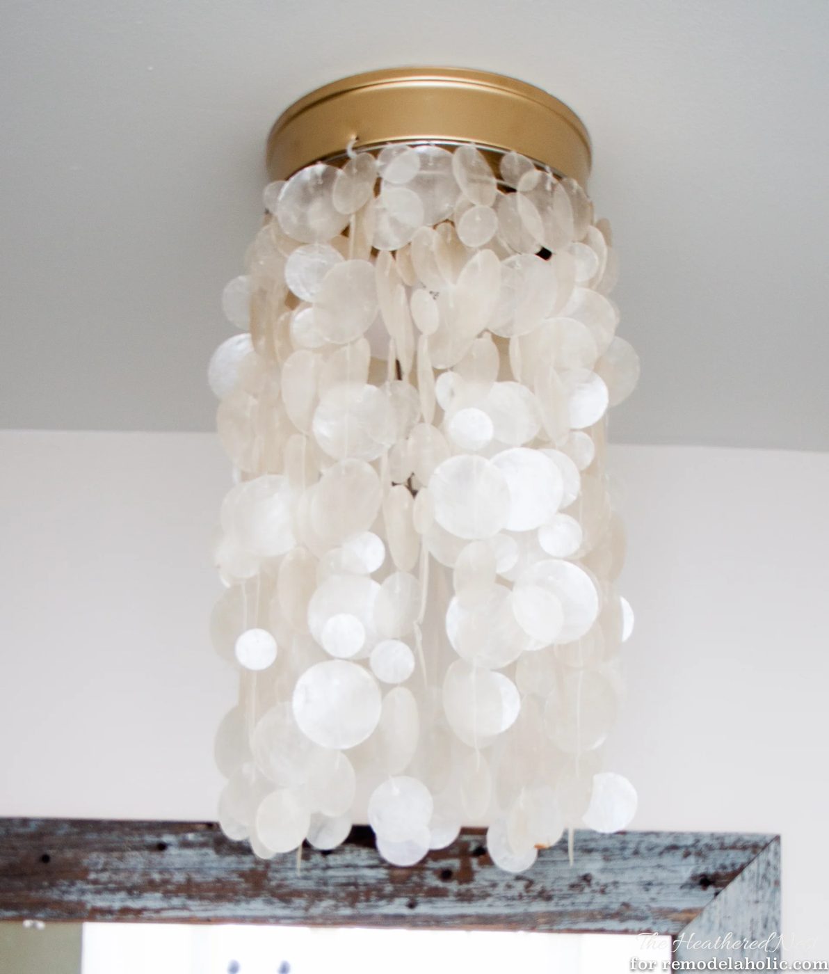 Ban your boob light! Change it to a drum shade or capiz fixture in as little as five minutes, no tools required!