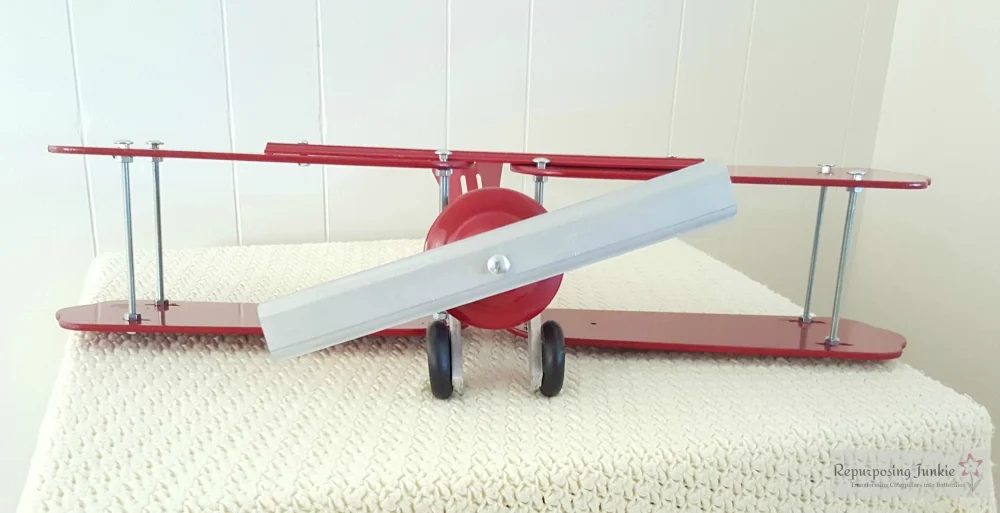 17 Build decorative airplane from repurposed ceiling fan blades, front view 3, by Repurposing Junkie featured on @Bekob